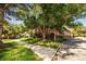 Brick building on a sunny day featuring a paved sidewalk and grassy yard area at 6001 S Yosemite St # B206, Greenwood Village, CO 80111