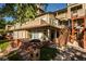 Charming townhouse featuring brick accents, outdoor stairs, and well-kept landscaping at 6001 S Yosemite St # B206, Greenwood Village, CO 80111