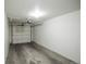 Spacious single-car garage with white walls and a functional door at 6001 S Yosemite St # B206, Greenwood Village, CO 80111
