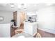 Open-concept floorplan featuring living room, dining area, and kitchen with grey cabinetry at 6001 S Yosemite St # B206, Greenwood Village, CO 80111