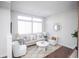 Bright and airy living room is freshly painted with new flooring and lots of natural light at 6001 S Yosemite St # B206, Greenwood Village, CO 80111