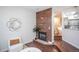 Living room features hardwood floors, modern fireplace, and open floorplan at 6001 S Yosemite St # B206, Greenwood Village, CO 80111