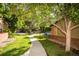 Well-maintained sidewalk winding through a lush, green residential neighborhood at 6001 S Yosemite St # B206, Greenwood Village, CO 80111