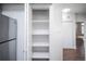 Pantry features an open storage with adjustable shelves at 6001 S Yosemite St # B206, Greenwood Village, CO 80111