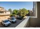 Balcony view overlooking ample parking space and well-maintained buildings at 6001 S Yosemite St # B206, Greenwood Village, CO 80111