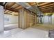 Unfinished basement with framed walls, utilities, exposed ceiling and concrete floor at 616 Wild Ridge Cir, Lafayette, CO 80026