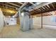 Unfinished basement featuring utilities, exposed ceiling, and concrete floors at 616 Wild Ridge Cir, Lafayette, CO 80026