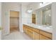 Bathroom featuring double sinks, a vanity with drawers, and a shower in the mirror's reflection at 616 Wild Ridge Cir, Lafayette, CO 80026