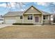 Charming single-Gathering home with a well-maintained lawn and a welcoming front porch at 616 Wild Ridge Cir, Lafayette, CO 80026