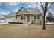 Lovely home with a beautiful yard and a cozy front porch, perfect for relaxing at 616 Wild Ridge Cir, Lafayette, CO 80026