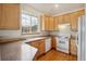 Functional kitchen with wood cabinets and ample counter space at 616 Wild Ridge Cir, Lafayette, CO 80026