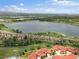 Stunning aerial view of the community with a lake and scenic surroundings at 2468 Channel Dr, Highlands Ranch, CO 80129
