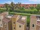 Aerial view of rooftops featuring outdoor living spaces and a neighborhood with a greenbelt at 2468 Channel Dr, Highlands Ranch, CO 80129