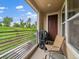 Relaxing balcony with seating, a grill, and a view of the surrounding landscape at 2468 Channel Dr, Highlands Ranch, CO 80129