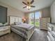 Serene bedroom showcasing neutral colors, plush carpet, and a large window at 2468 Channel Dr, Highlands Ranch, CO 80129