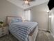 Cozy bedroom with neutral walls, carpet and a comfortable queen-sized bed at 2468 Channel Dr, Highlands Ranch, CO 80129