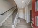 Modern entryway with a staircase, sleek railing, and stylish bench seating at 2468 Channel Dr, Highlands Ranch, CO 80129