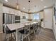 Bright kitchen featuring a large island with pendant lighting and stainless steel appliances at 2468 Channel Dr, Highlands Ranch, CO 80129