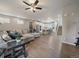 Spacious living area connects to a modern kitchen with laminate floors throughout at 2468 Channel Dr, Highlands Ranch, CO 80129