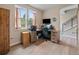 Functional home office featuring a large desk, ample storage, and natural light at 2468 Channel Dr, Highlands Ranch, CO 80129