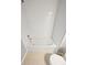 Bathroom with a bathtub and white tiled walls at 14948 E Belleview Ave, Aurora, CO 80015