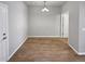 Simple dining room with light walls and wood flooring at 14948 E Belleview Ave, Aurora, CO 80015