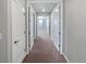 Bright hallway with carpet flooring and neutral walls at 14948 E Belleview Ave, Aurora, CO 80015