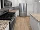 Modern kitchen with stainless steel appliances and granite countertops at 14948 E Belleview Ave, Aurora, CO 80015