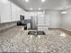 Modern kitchen featuring stainless steel appliances and granite countertops at 14948 E Belleview Ave, Aurora, CO 80015