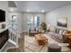 Virtually staged living room featuring a gray sofa and a modern coffee table at 14948 E Belleview Ave, Aurora, CO 80015