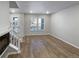 Bright living room with hardwood floors and a fireplace at 14948 E Belleview Ave, Aurora, CO 80015