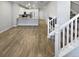 Open living area with kitchen, fireplace, and hardwood floors at 14948 E Belleview Ave, Aurora, CO 80015