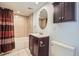 Traditional bathroom with shower and bath and plenty of storage, features ceramic tile floors at 4760 S Wadsworth Blvd # M302, Littleton, CO 80123
