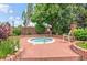 Community hot tub surrounded by mature trees and landscaping providing a private oasis at 4760 S Wadsworth Blvd # M302, Littleton, CO 80123
