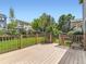 Inviting backyard deck with wood railing, perfect for entertaining or relaxing at 13472 Columbine Cir, Thornton, CO 80241