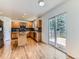 Modern kitchen featuring wooden cabinets, granite countertops, and a stainless steel appliances at 13472 Columbine Cir, Thornton, CO 80241