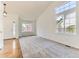 Bright living room with vaulted ceilings, large windows, and a neutral color palette at 13472 Columbine Cir, Thornton, CO 80241