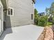 Exterior view showing the side yard with a concrete patio and some greenery at 13472 Columbine Cir, Thornton, CO 80241