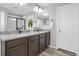 Modern bathroom with double sinks and granite countertops at 2523 Villageview Ln, Castle Rock, CO 80104