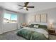 Spacious bedroom with a large window and neutral decor at 2523 Villageview Ln, Castle Rock, CO 80104