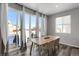 Bright dining area with sliding glass doors leading to a deck and a view at 2523 Villageview Ln, Castle Rock, CO 80104