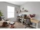 Home office featuring two desks, ergonomic chairs, and a large window at 2523 Villageview Ln, Castle Rock, CO 80104