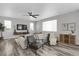 Spacious living room with a neutral color palette, a large sectional sofa and hardwood floors at 2523 Villageview Ln, Castle Rock, CO 80104