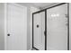 Clean shower with white subway tiles and a frameless glass door at 2523 Villageview Ln, Castle Rock, CO 80104