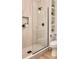 Modern walk-in shower with a glass enclosure, tiled walls, and built-in shelving for a spa-like experience at 2738 N Clay St, Denver, CO 80211