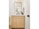 Stylish bathroom vanity with modern fixtures, black mirror, and neutral tones for a clean and minimalist design at 2738 N Clay St, Denver, CO 80211