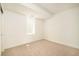 Simple bedroom with carpet, a window, and white walls creating a blank canvas for personalization at 2738 N Clay St, Denver, CO 80211