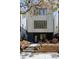 Modern exterior of a home with black trim windows, landscaped front yard, and brick retaining wall at 2738 N Clay St, Denver, CO 80211