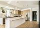 Bright kitchen features a large island, stainless appliances, and stylish pendant lighting at 2738 N Clay St, Denver, CO 80211