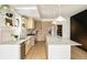 Open kitchen with stainless steel appliances, modern lighting, and a spacious island at 2738 N Clay St, Denver, CO 80211